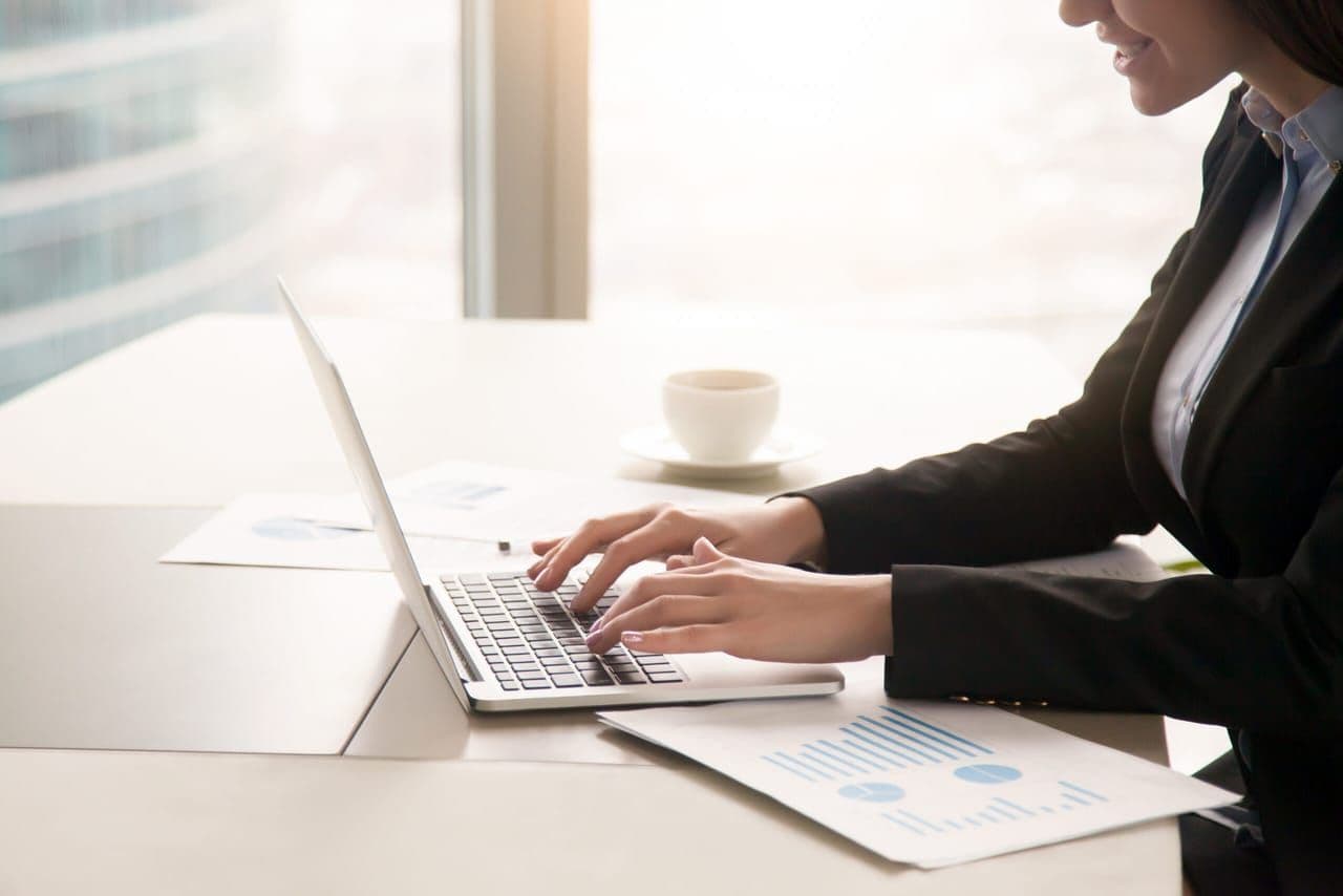 Professional businesswoman working with data and analytics in modern office environment